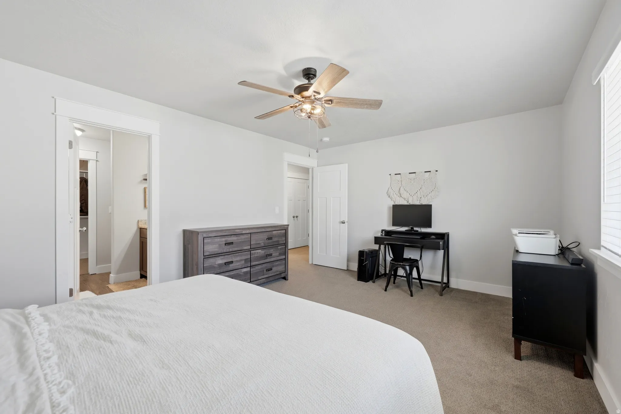Ceiling fan with light fixture, neutral wall color, carpeted flooring, window with blinds