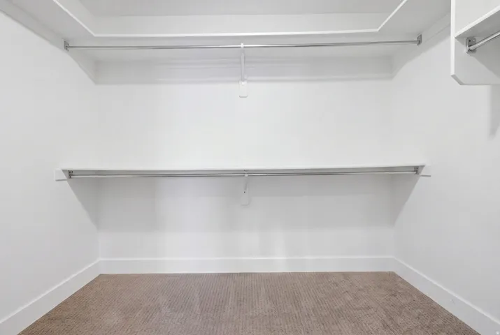 White walls with light-colored carpeting