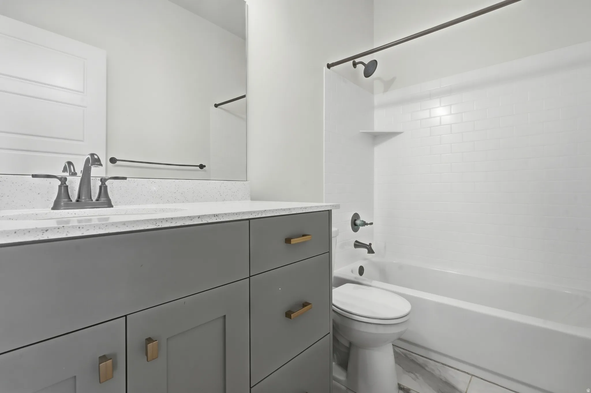 Vanity with ample storage and stone-finish countertop