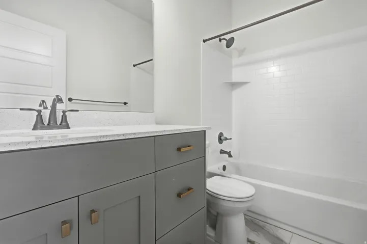 Vanity with ample storage and stone-finish countertop