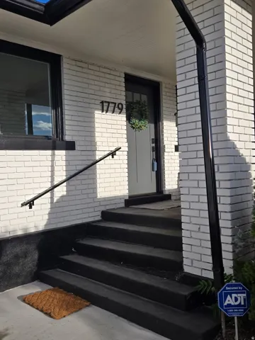 Painted brick exterior with contrasting black trim