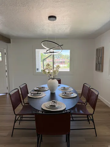 Recessed window framing, wood-finish flooring, and modern ceiling lighting