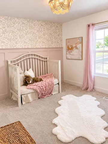 Carpeted flooring, accent wall with decorative wallpaper, board and batten wall treatment, window with natural light, and ornate ceiling light fixture