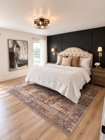 Wood-finish flooring, accent wall with paneling, window with natural light, modern ceiling-mounted light fixture, and wall-mounted sconces
