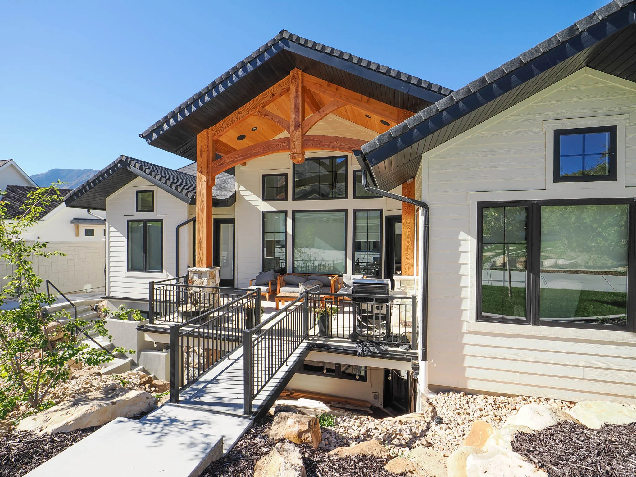 White horizontal siding exterior with black-framed windows