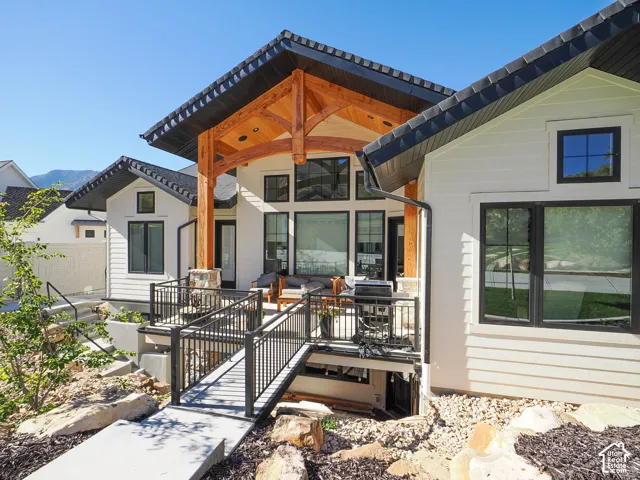 White horizontal siding exterior with black-framed windows