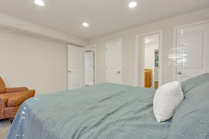 Recessed lighting illuminates neutral-toned walls