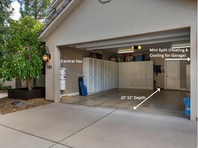 3 Car Garage with Epoxy Floor, Built-in Cabinetry, & a Mini-Split