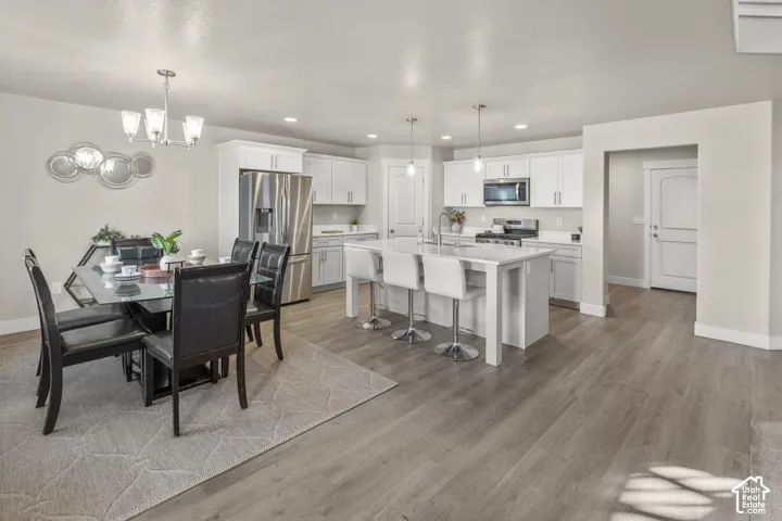 Open-concept living space with wood-finish flooring