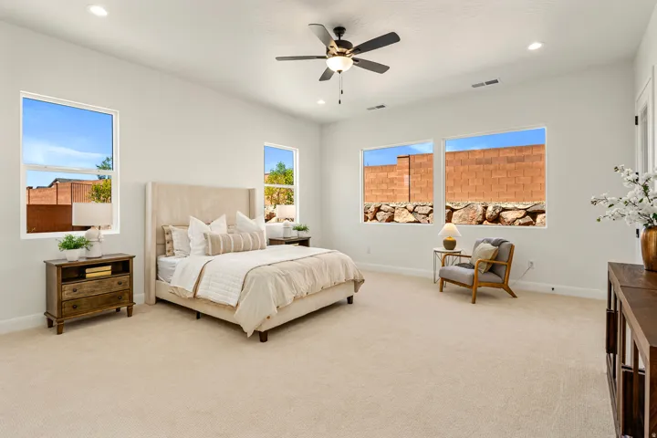 Recessed lighting and ceiling fan complement the neutral wall finishes