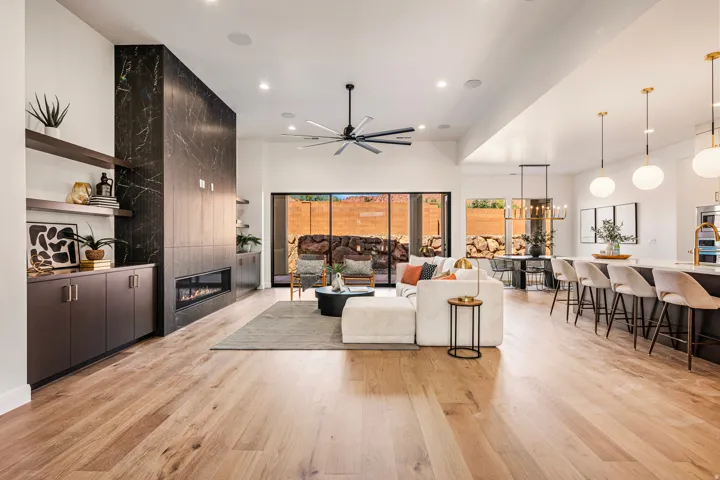 Open-concept living area with wood-finish flooring