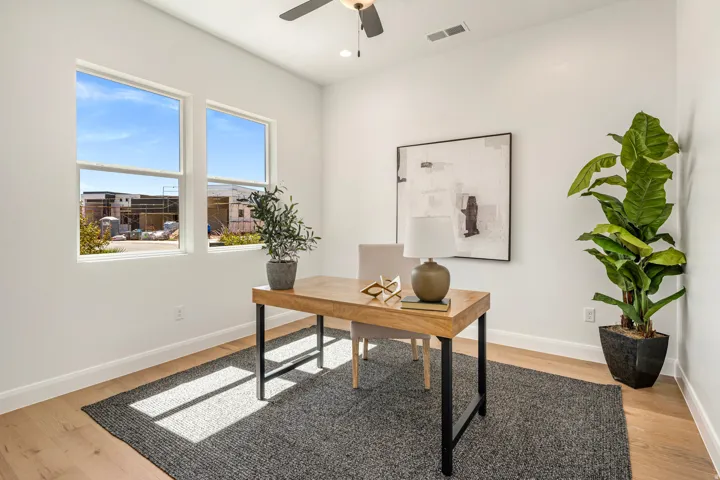 Dual pane windows, wood-finish flooring, white painted walls, ceiling fan, recessed lighting