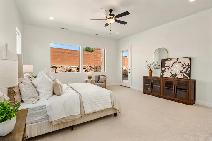 Recessed lighting, ceiling fan, multiple windows, glass-paneled door, and built-in cabinetry