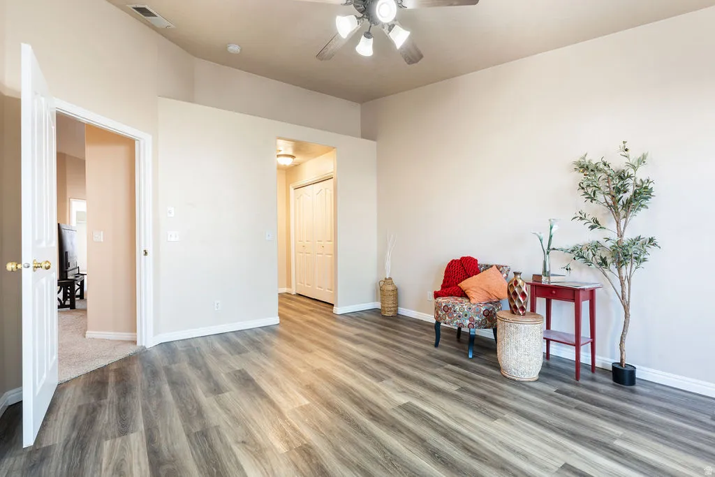 Wood-finish flooring throughout, vaulted ceiling, and recessed entryways
