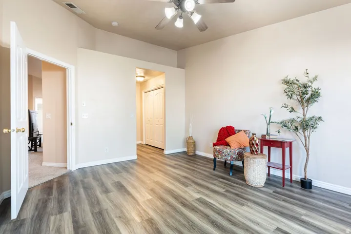 Wood-finish flooring throughout, vaulted ceiling, and recessed entryways