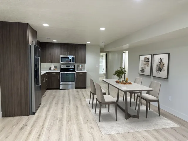 Kitchen featuring wood-look cabinetry, stainless steel appliances, and white countertops