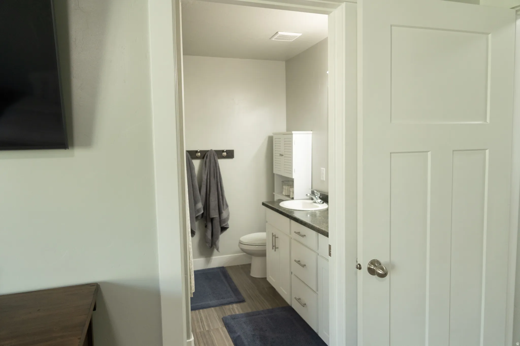 White paneled door with brushed nickel hardware