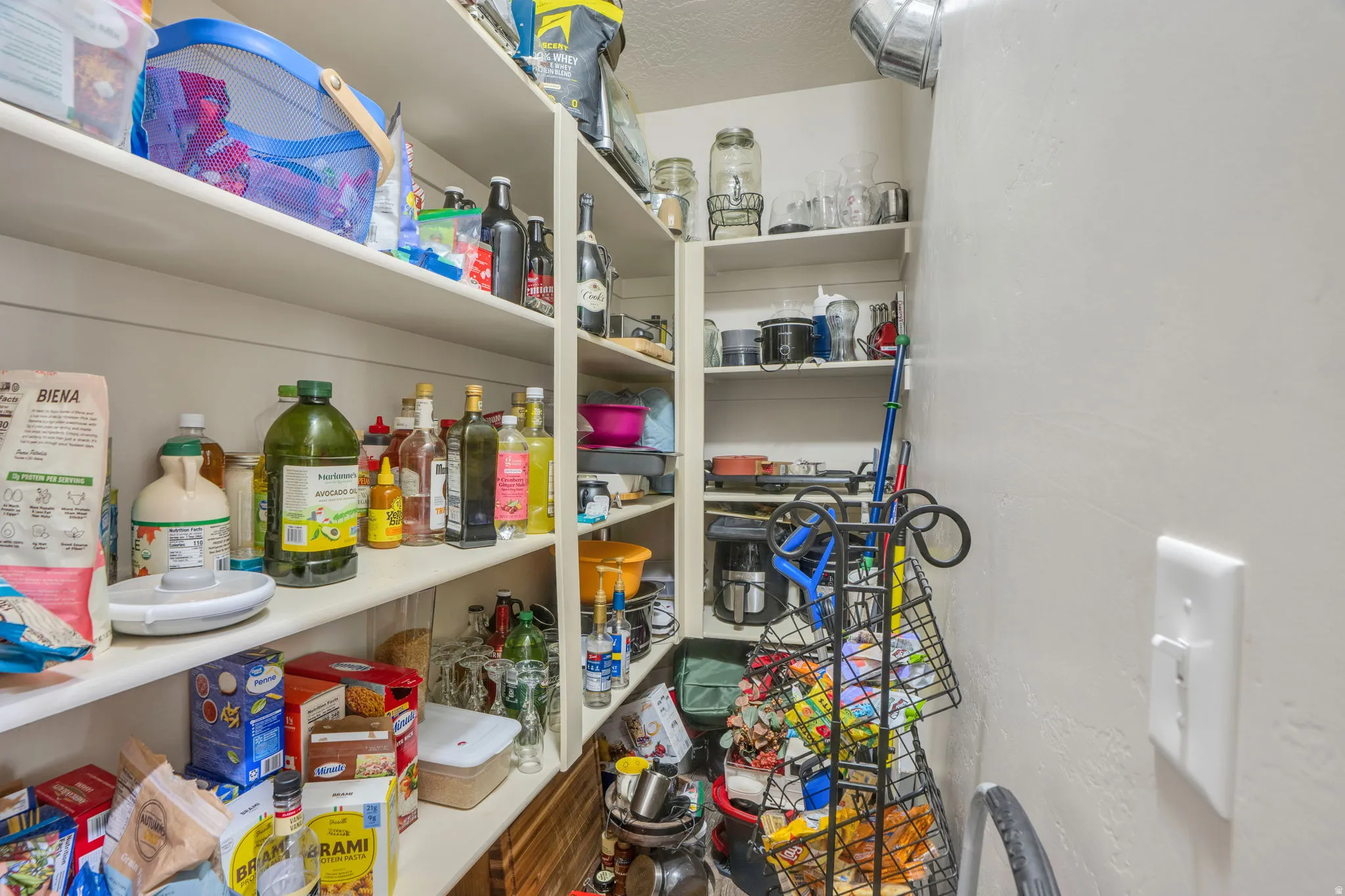 Wall-mounted shelving system featuring multiple tiers