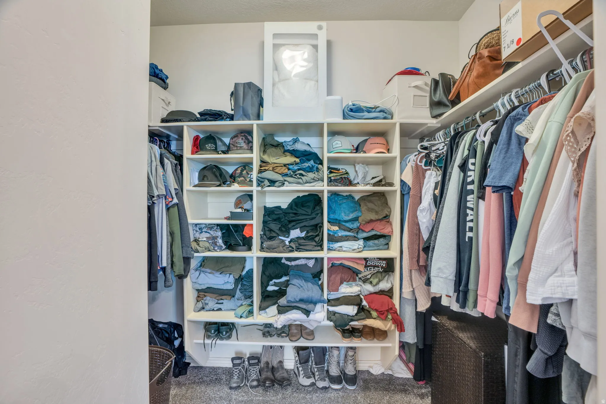 Built-in shelving with multiple cubbies and hanging storage