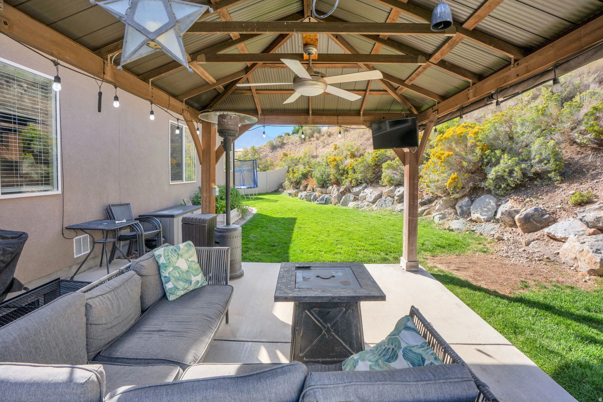 Covered patio with a metal roof and exposed wood beams