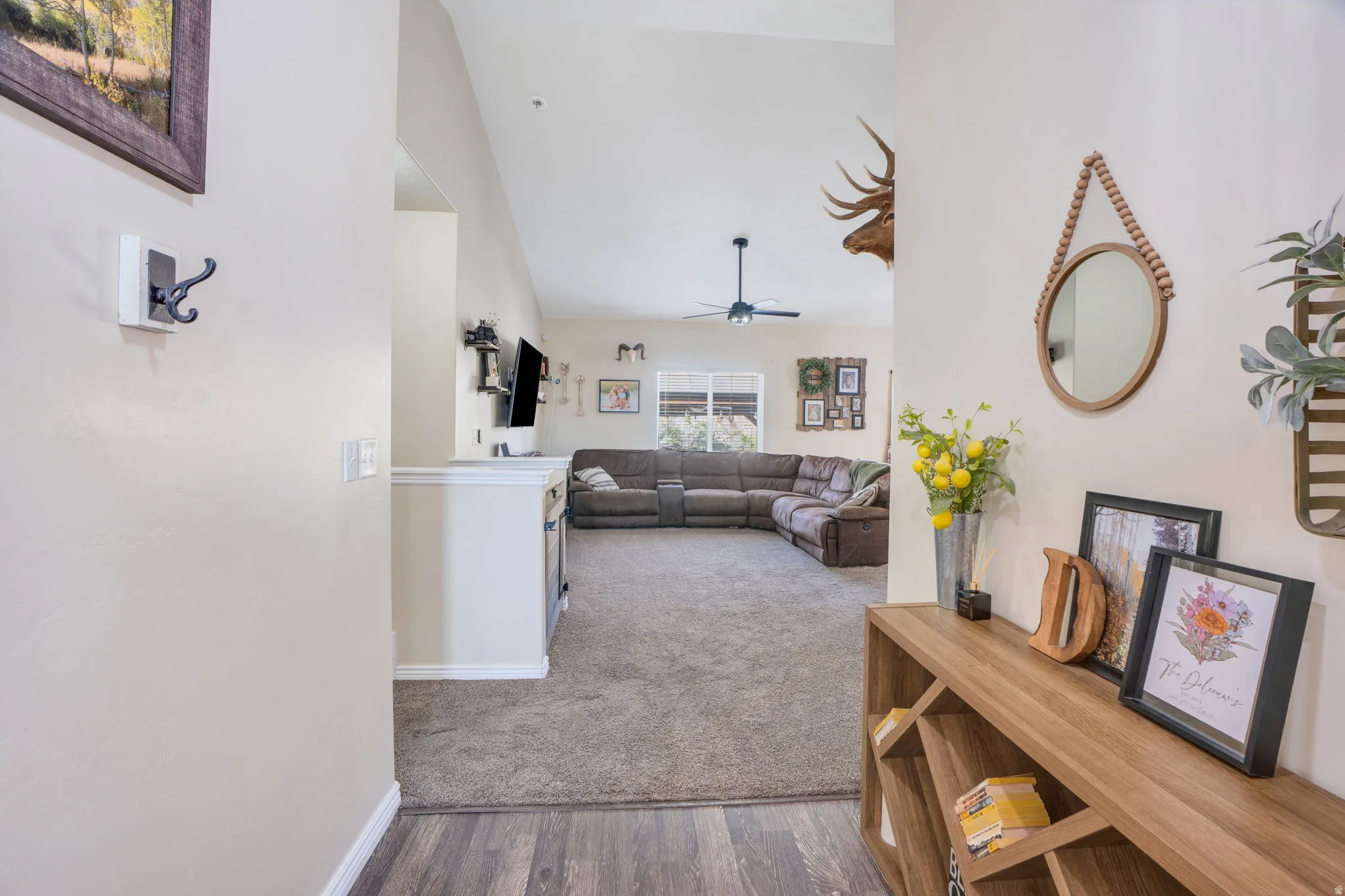 Vaulted ceilings, wood-finish flooring, and carpeted living area