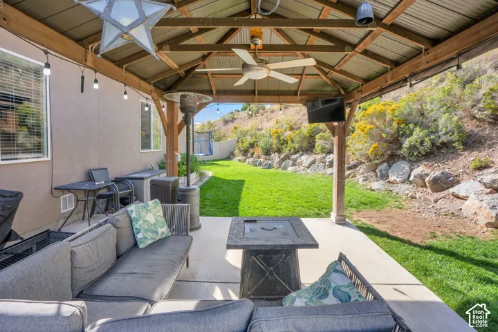 Covered patio with a metal roof and exposed wood beams