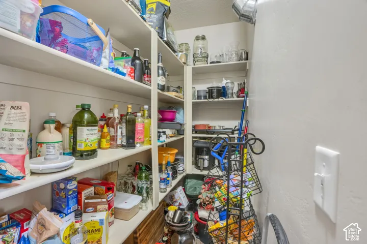 Wall-mounted shelving system featuring multiple tiers