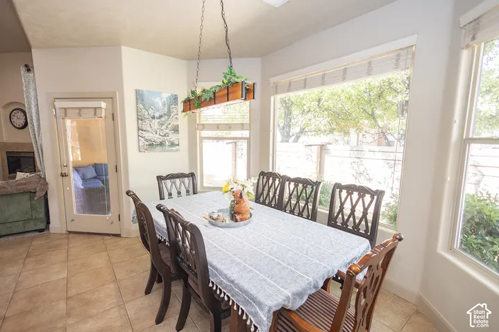 Tiled flooring, multiple windows, and a built-in fireplace