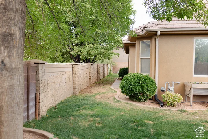 Stucco exterior with a tiled roof