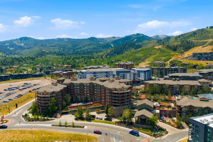 Expansive mountain community featuring multi-story residential buildings and visible parking areas