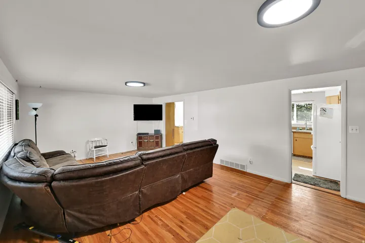 Hardwood flooring with white walls and ceiling