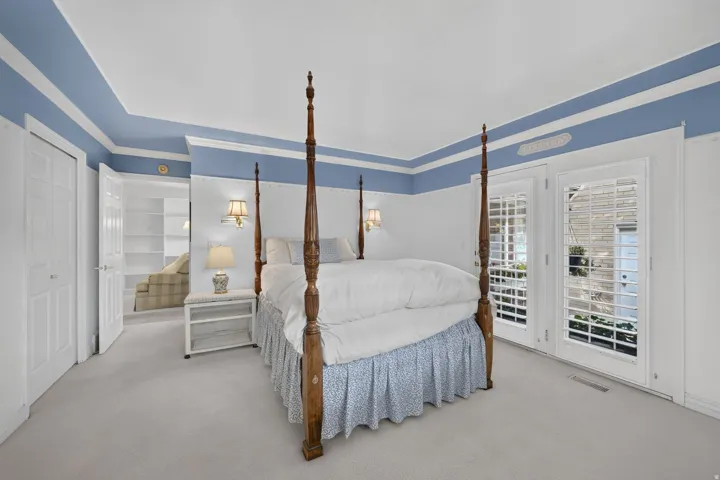 Wall-to-wall carpeting and white trim throughout