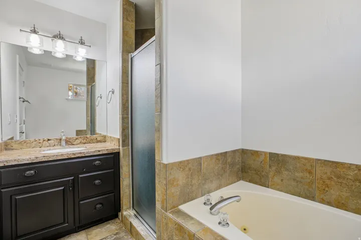 Dark wood-finish vanity with a light-toned countertop