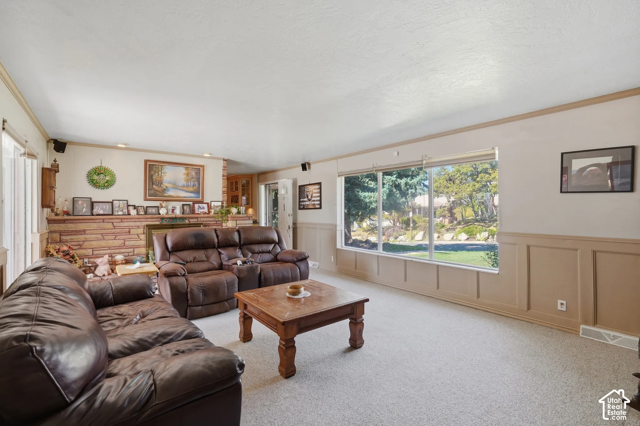 Living room facing gas fireplace #1 and kitchen.