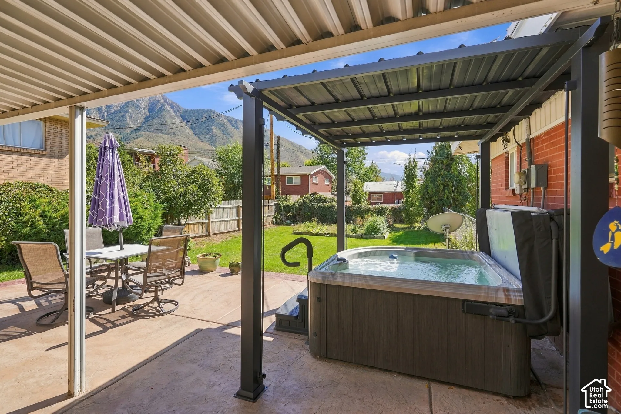 Back patio from the back door, with a hot tub.