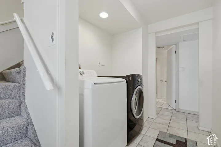 Laundry area with basement entrance.