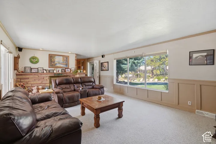 Living room facing gas fireplace #1 and kitchen.