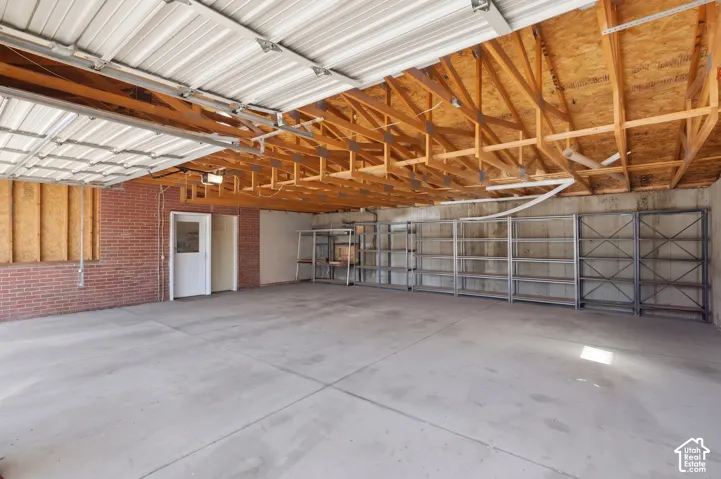 Oversized 3 car garage, items in garage virtually removed.