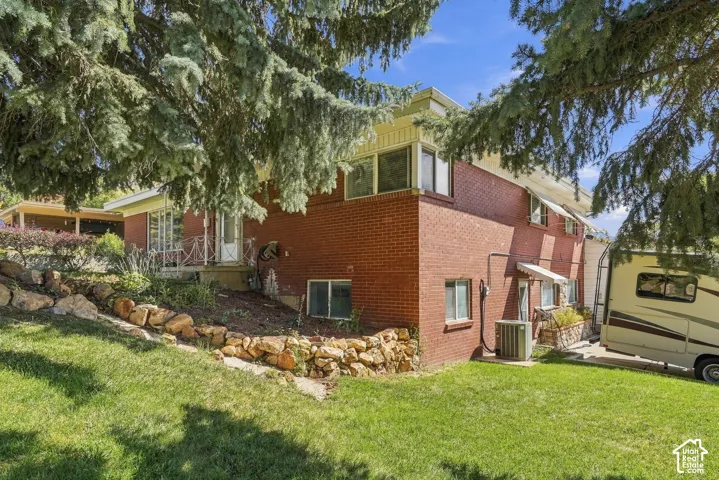 Corner view of home facing basement entrance.