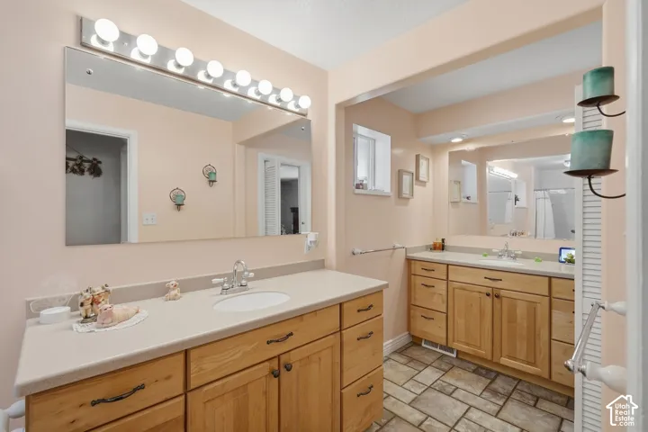 3/4 bathroom with access to primary bedroom.