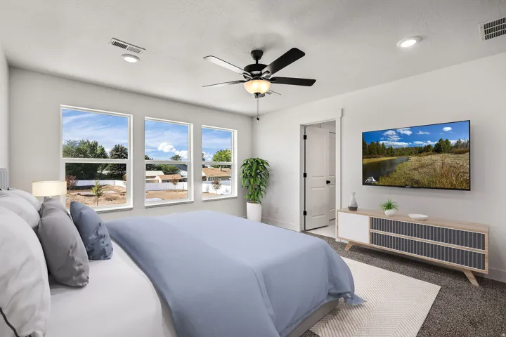 Recessed lighting, ceiling fan, white trim, wall-mounted television, and carpeted flooring