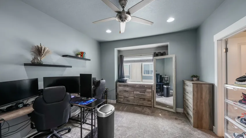 Recessed lighting, ceiling fan, and carpeted flooring