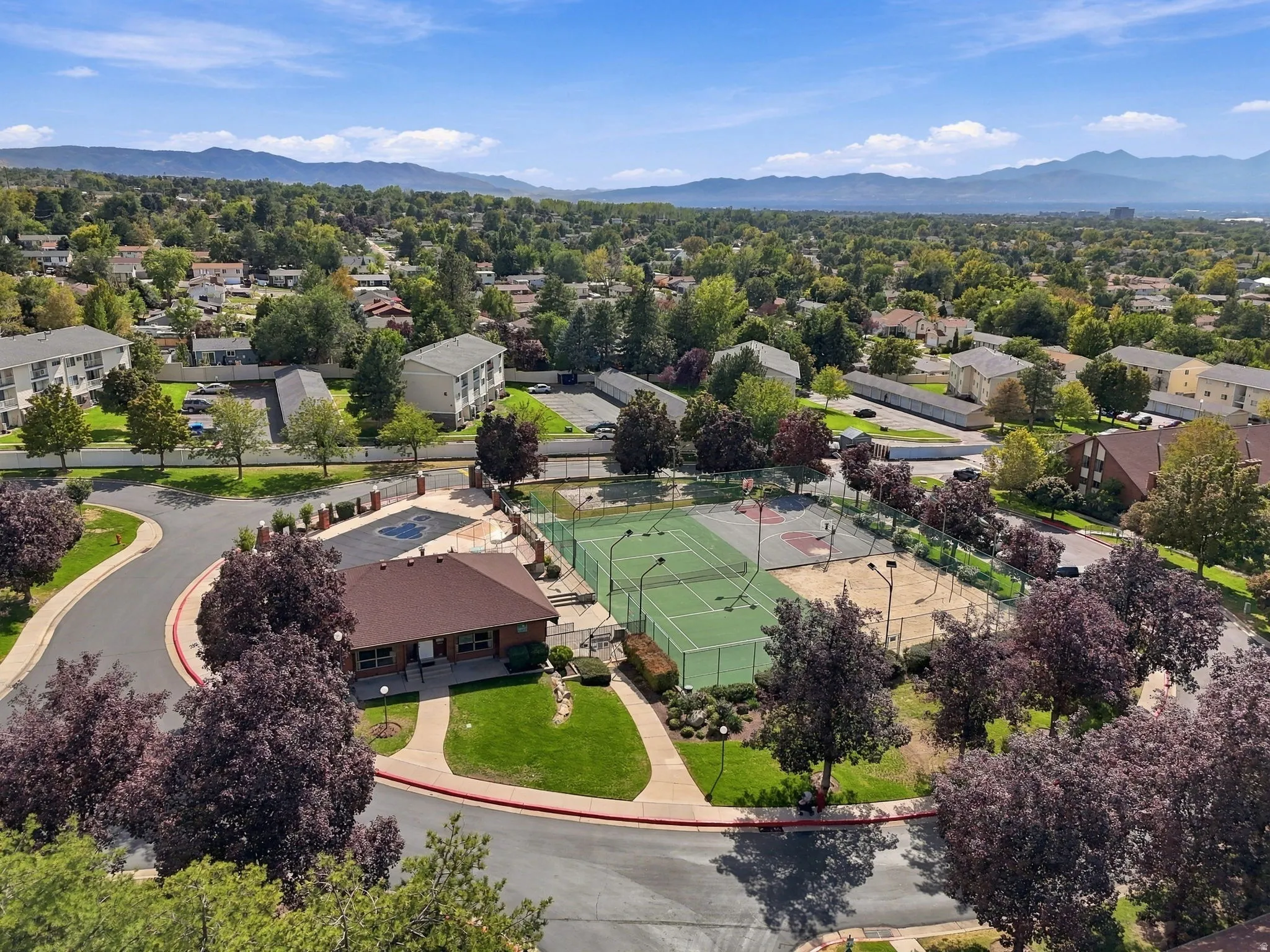 Community amenities featuring a clubhouse, outdoor pool, tennis courts, and basketball court