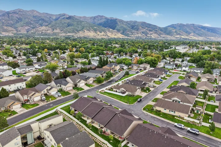 Residential neighborhood with established landscaping and mountain backdrop