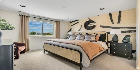 Recessed lighting, large window with outdoor scenery, light-colored carpeting, decorative wall paneling. This home is under construction. Pictures are of a similar home.
