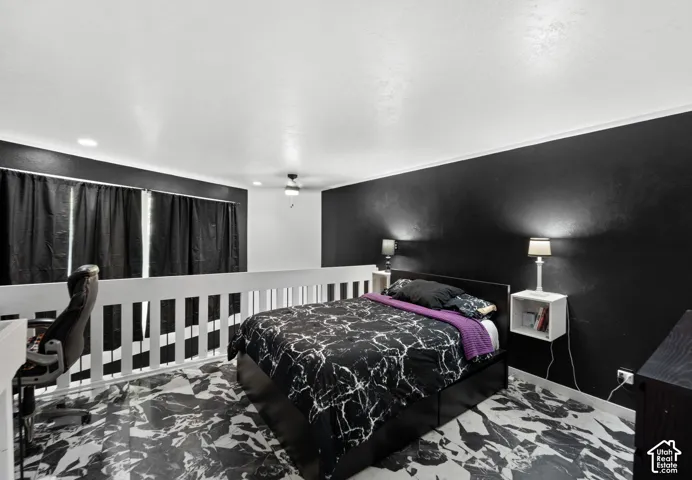 Loft bedroom featuring a ceiling fan, recessed lighting, and expansive windows with dark blinds
