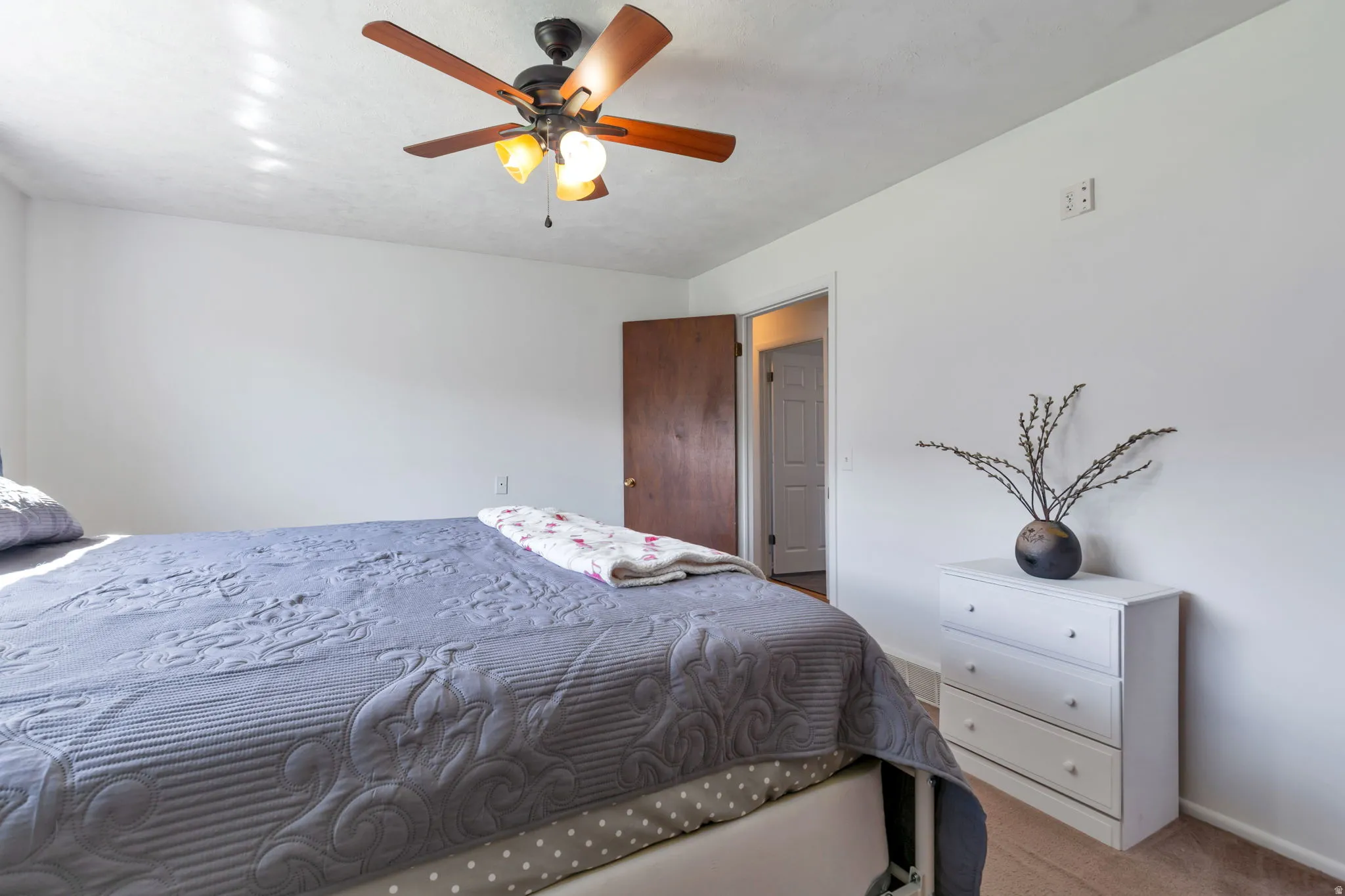 Wood-finish ceiling fan with integrated lighting