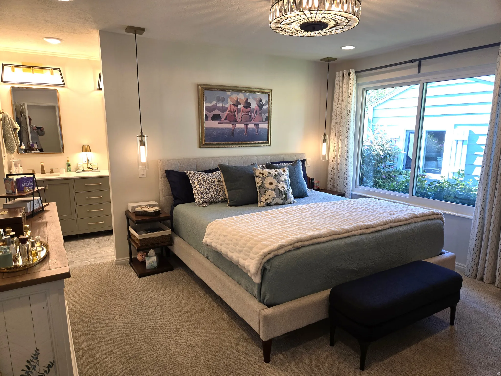Carpeted flooring, recessed lighting, and a crystal chandelier
