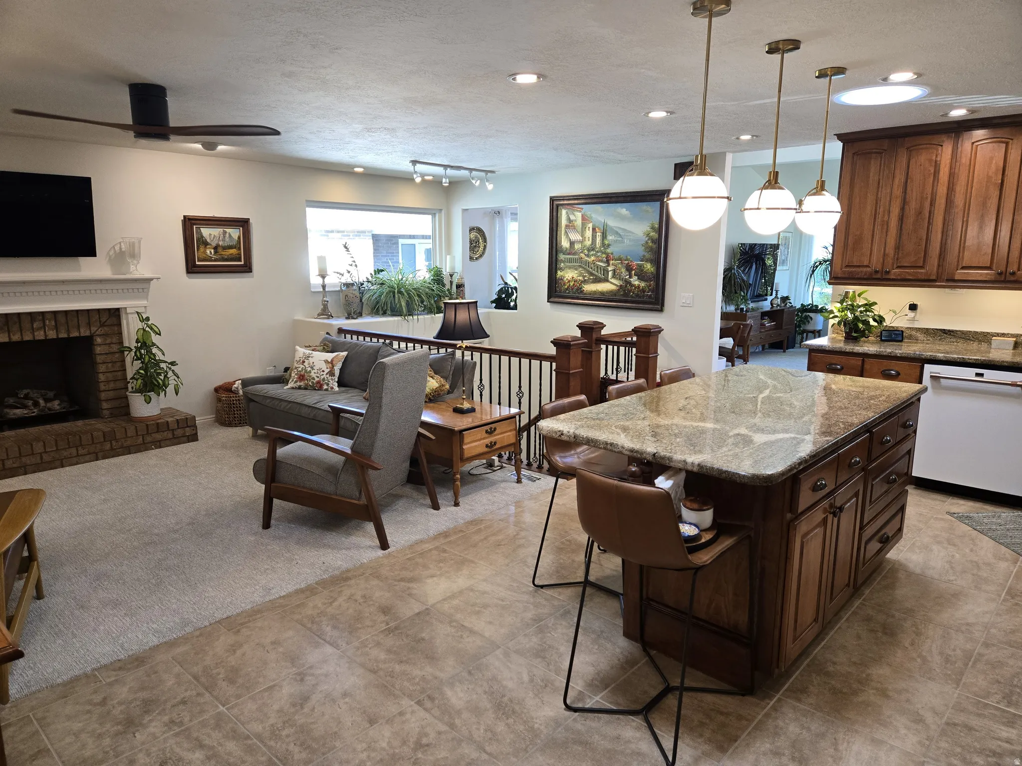 Kitchen island with a light-toned stone countertop