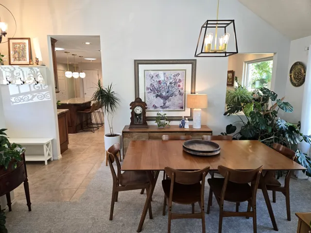 Vaulted ceiling with an open-frame pendant light fixture